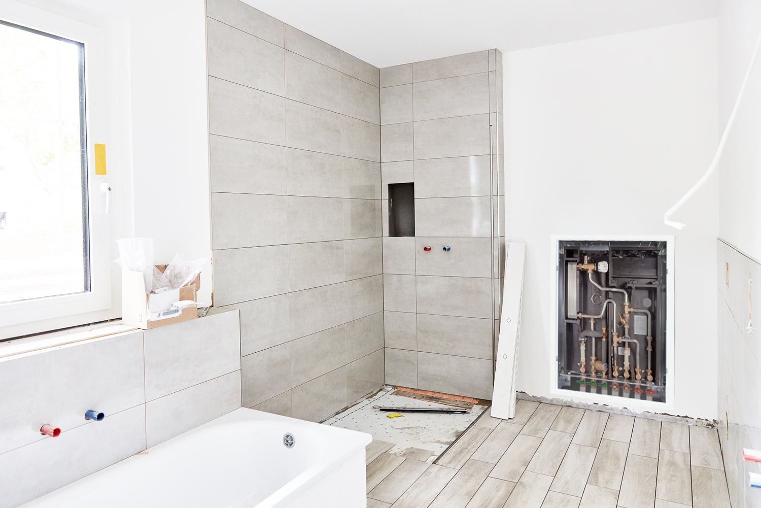 Built-in flat HIU station on a building site in the bathroom